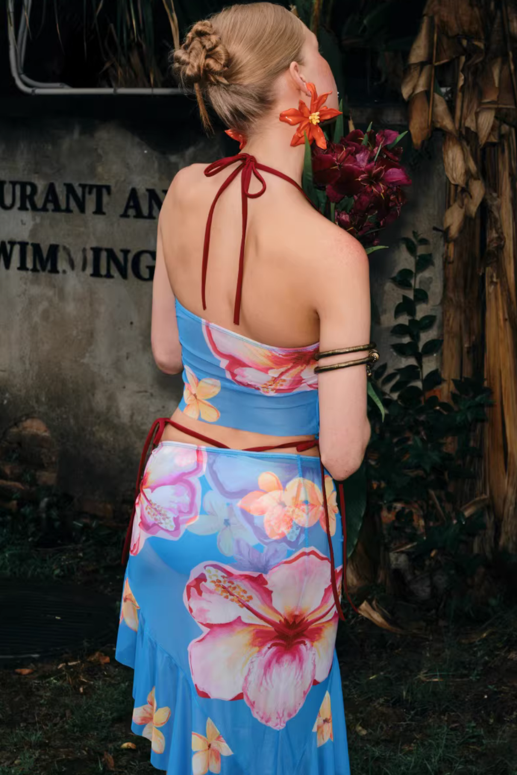 Woman wearing a floral dress with a blurred background
