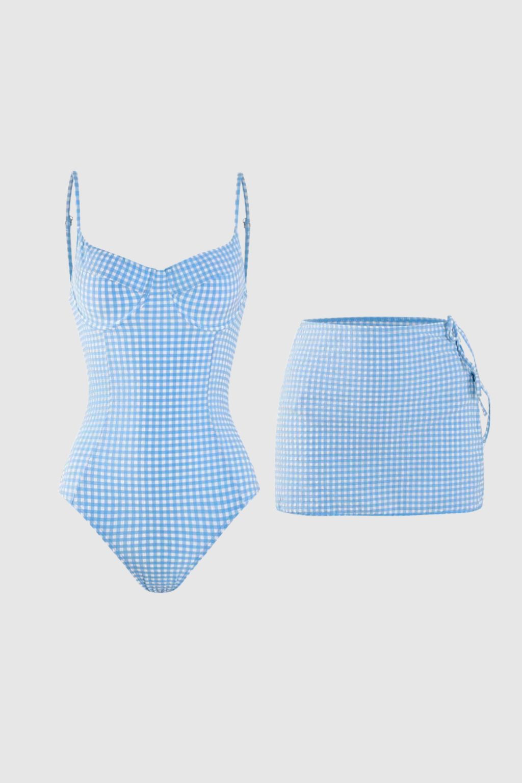 Blue gingham swimsuit with matching skirt on a light gray background